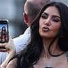 Awkward! Kim Kardashian poses for photo taken by sister Khloe... but there is a hilarious catch