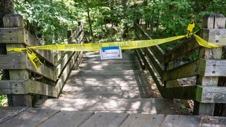 Police search for suspect in deaths of couple attacked while walking with daughters at Arkansas park