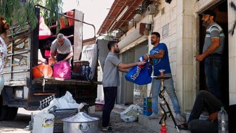 Alawite families flee Damascus suburb after violence and eviction threats