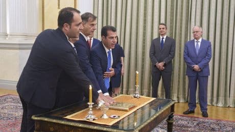 A hard-right lawmaker is sworn in as Greece's migration minister