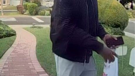 New York City police hunt for man suspected of killing elderly couple and burning their home