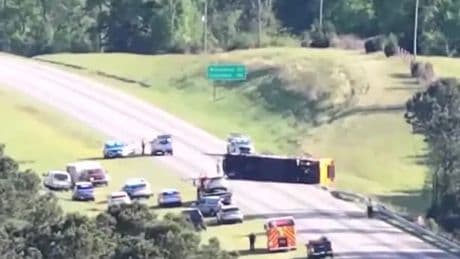 Student, 13, dies after bus full of children overturns on way back from school trip