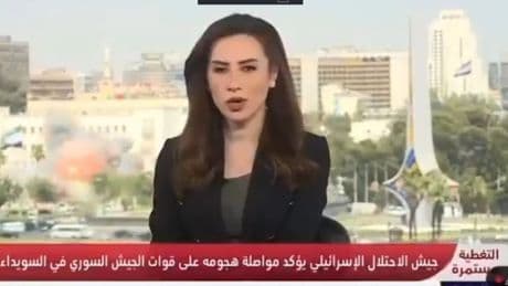 Terrified TV reporter runs for cover as Israel bombs Syrian military HQ