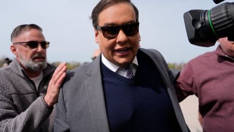 Disgraced former Republican Rep. George Santos reports to prison to begin seven-year sentence