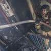 Buildings burn as another wave of Russian attacks hits Ukraine