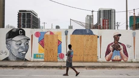 A mural honoring Jackie Robinson and Minnie Miñoso is defaced with racist graffiti in Miami