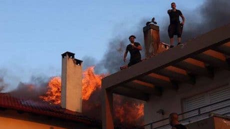 Greece wildfires: Tourists and locals flee burning Athens - and islands including Crete