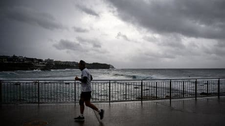 Australia bomb cyclone live: Coastal residents told to ‘evacuate now’ as powerful storm halts flights
