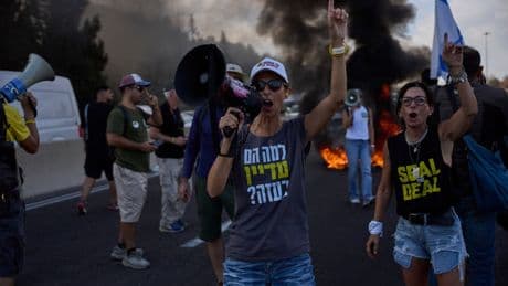 Photos of Israelis demanding the release of hostages and an end to the war with Hamas