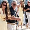 Amal Clooney, 47, looks stylish in butter yellow summer dress as she arrives in Venice hand in hand with her husband George, 64, ahead of the Film Festival