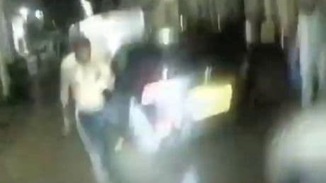 Terrifying moment topless knifeman lunges at cops with blade after biting man’s EAR off in robbery gone wrong