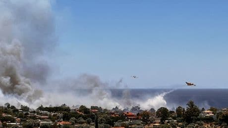 Wildfire prompts evacuations near Athens as summer's first heat wave hits Greece
