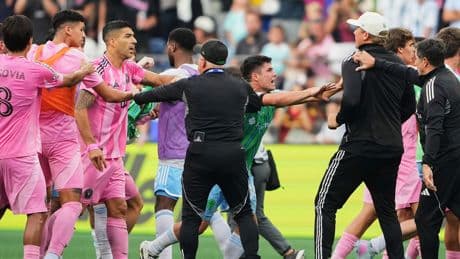 Football star Luis Suarez apologises for spitting at rival team's staff member