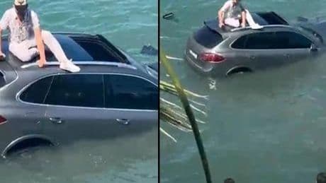 Otomobiliyle denize uçtu, dakikalarca batan aracın üzerinde kurtarılmayı bekledi