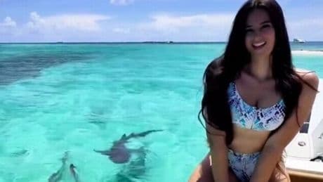 Model with £7m legs 'almost loses limb' in close encounter with three sharks