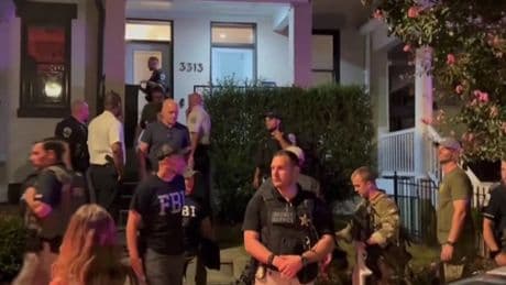 Protesters confront federal agents in D.C. after National Guard troops seen armed with guns
