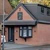 Neighbour who built a detached house on his driveway without permission finally makes it into a garage after six year planning row