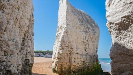 UK beach with golden sands and magical sea caves that appear at certain times of day