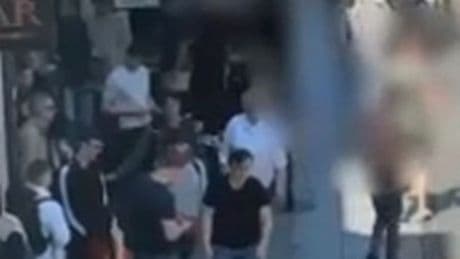 'Feral' street brawl captured on camera as men strip off shirts and hurl chairs