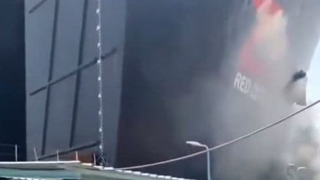 Moment cargo ship crashes into Suez Canal port as workers flee