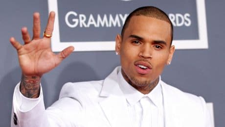 Rapper charged with GBH - after singer Chris Brown remanded in custody over 'bottle attack'