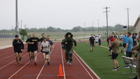 A US Army officer who handles explosives broke the world record for the mile run in a bomb suit. He was 20 seconds faster.