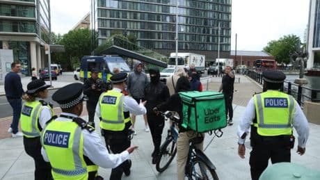 Anti-migrant mob stop Uber Eats burger delivery to Canary Wharf hotel