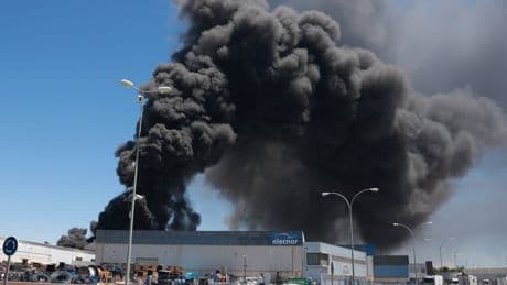 Residents told to close windows as huge fire sends black smoke across Spanish city