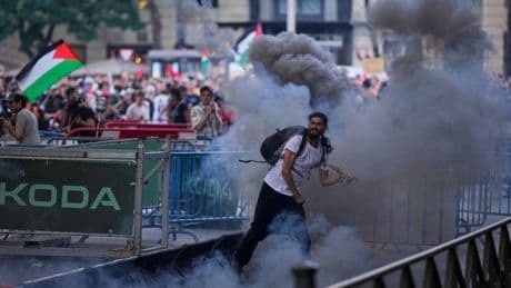 Chaotic scenes in Madrid as pro-Palestinian protesters disrupt final stage of Vuelta cycling race