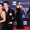 Kylie Jenner and boyfriend Timothee Chalamet FINALLY make their red carpet debut as she shows off her curves in a plunging black gown at glitzy awards show in Rome