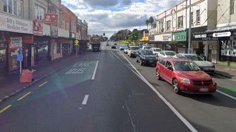 One dead and another critically injured after car ploughs into restaurant as police launch manhunt for driver