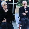 A frail Paul Hogan, 85, is pushed along in a wheelchair as he returns home to Australia amid rumours the icon is moving back Down Under for good