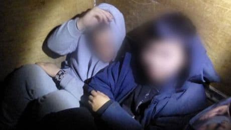Moment UK migrant smuggling operation foiled as people found squashed into rubbish-strewn van