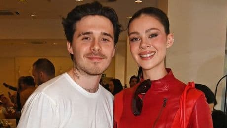 Nicola Peltz and Brooklyn Beckham shrug off family drama with steamy display