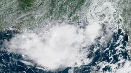 Gulf coast braces for flooding as storm system builds into possible tropical depression