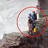 Dramatic moment coastguards abseil down Cornwall cliff face in daring rescue operation to save two people cut off by the tide
