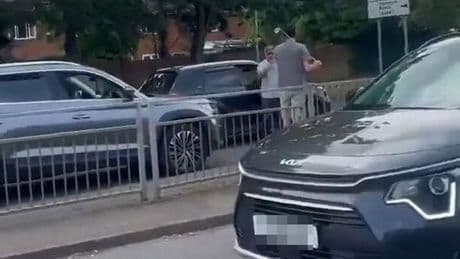 Moment road rager screams 'I’m f***ing bigger than you' while wielding golf club