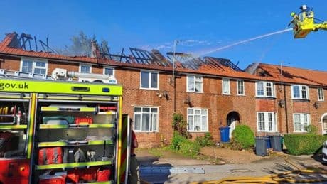 Fire spreads along row of homes in huge blaze in north London