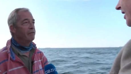 Moment Nigel Farage watches in fury as French Navy escorts 70 migrants to UK waters & hands them over to Britain