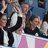 Kate Middleton shows her fun side as she takes part in a Mexican wave and enthusiastically cheers on the women's rugby team during World Cup match