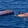 Boy, five, and his grandmother are blown two miles out to sea on a lilo after she rushed to help him and was unable to swim them back to shore
