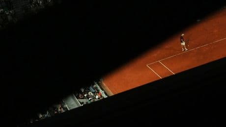 AP PHOTOS: Light and shadows add an extra dimension at the French Open tennis tournament
