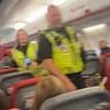 Passengers are hauled off plane by police after becoming 'uncontrollable' when they downed bottle of vodka during flight delay