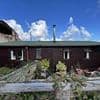 Couple build chalet without permission in national park and live in it for TWENTY SEVEN years... and thanks to council blunder they aren't going anywhere