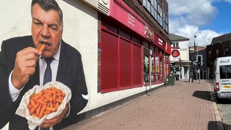 Mystery artwork of former England boss eating chips appears on town centre wall