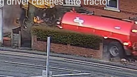 Tractor carrying animal waste runs through homes after drug driver runs red light