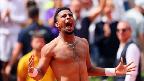 Home favourite Arthur Fils defies injury to win wild French Open rollercoaster