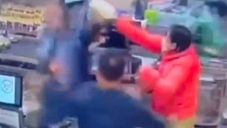 Police officer 'smashes bottle of milk over customer's head' in supermarket CCTV