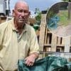 Furious builder is fined £500 by council busybody for flytipping after he left two empty sacks on grass verge while renovating house