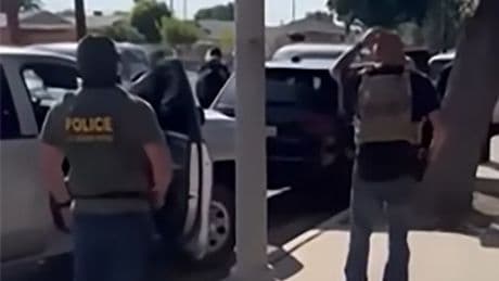 Horror moment immigration cops handcuff disabled boy sitting in car with his nan